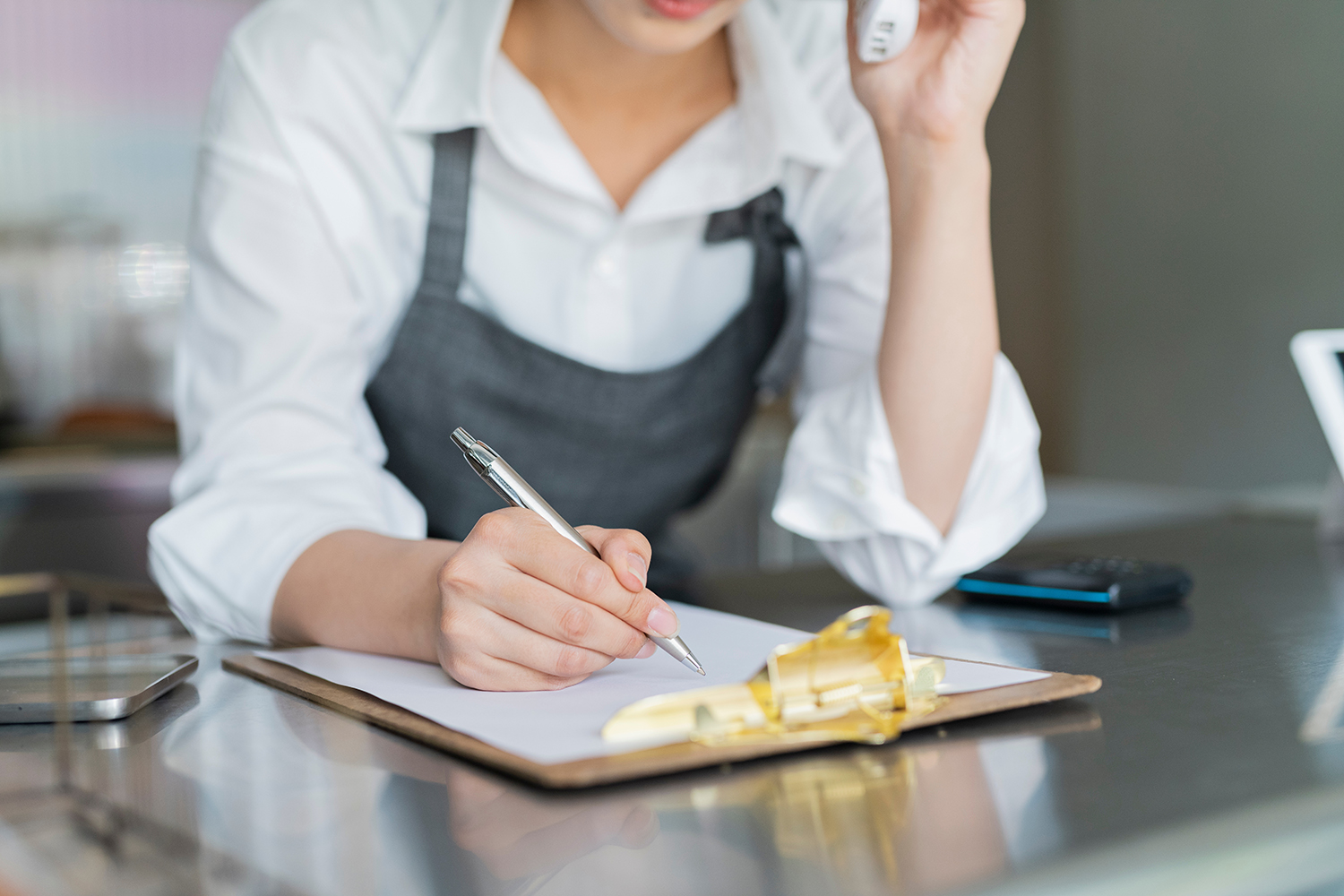 Cafe,Female,Staff,Making,Phone,Calls